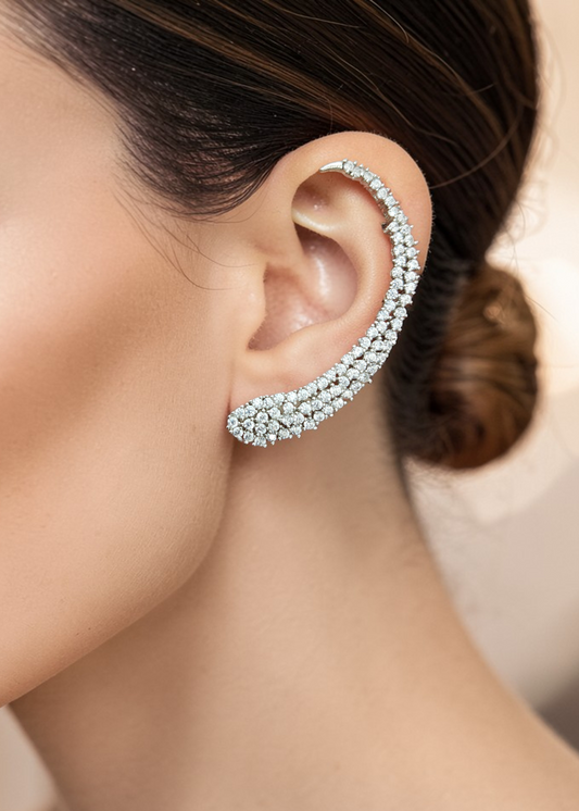 Model wearing Celeste White Crystal Ear Cuff with sparkling white crystals in a silver-tone ear climber design