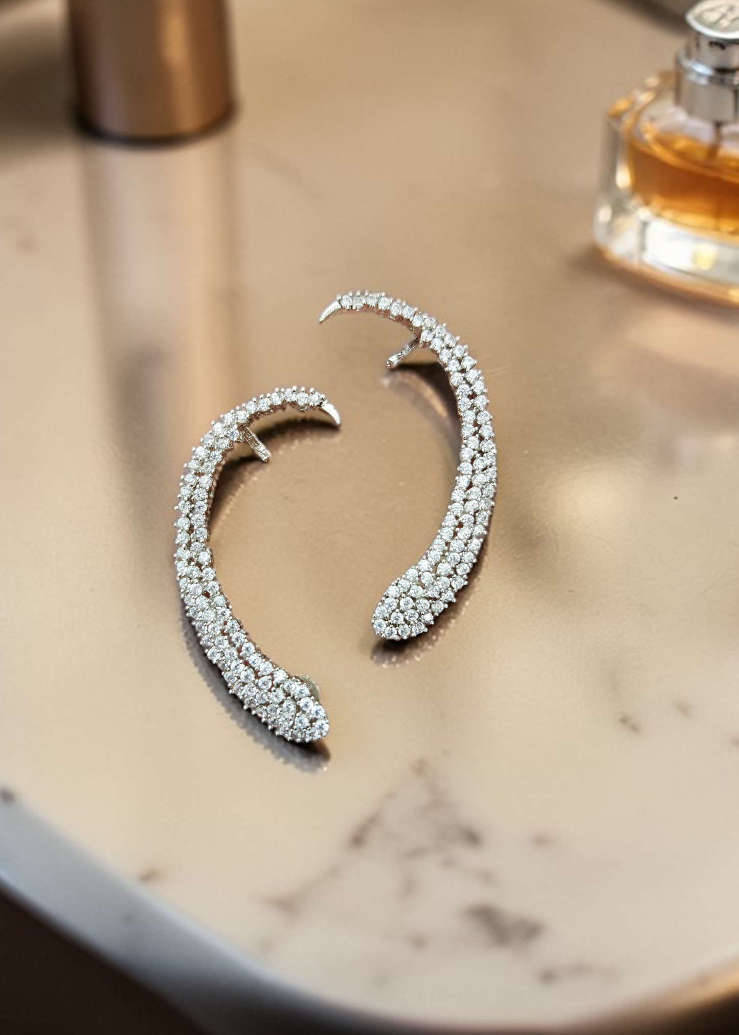 Close-up of Celeste White Crystal Ear Cuff worn on ear showcasing sparkling white crystal detailing