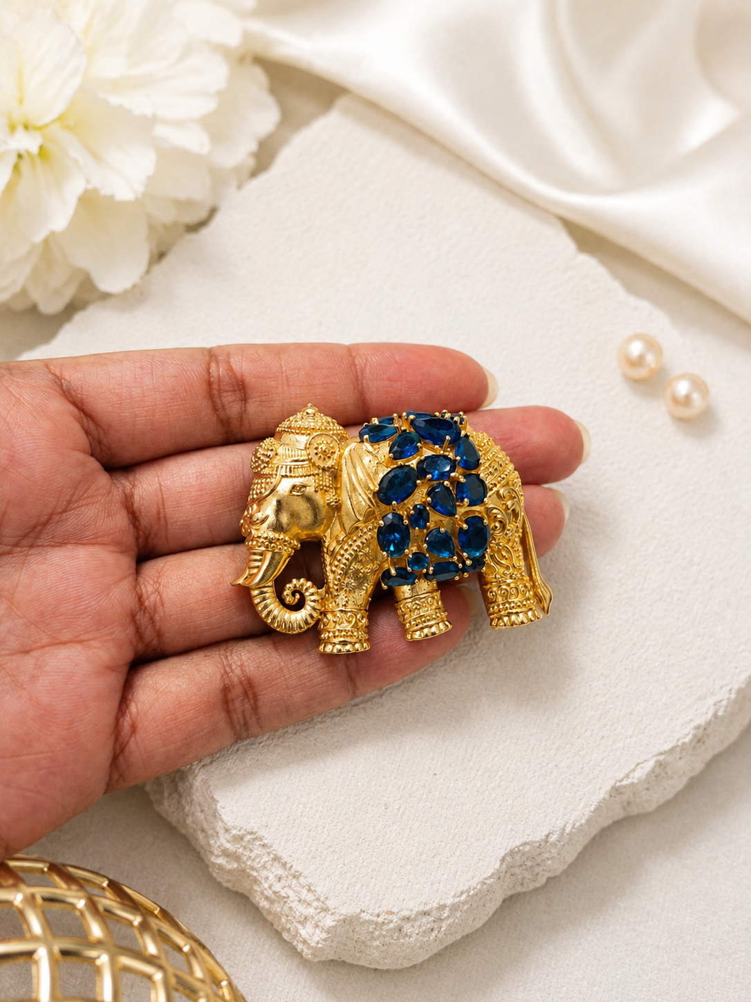 Royal Blue Elephant Brooch shown close up in hand