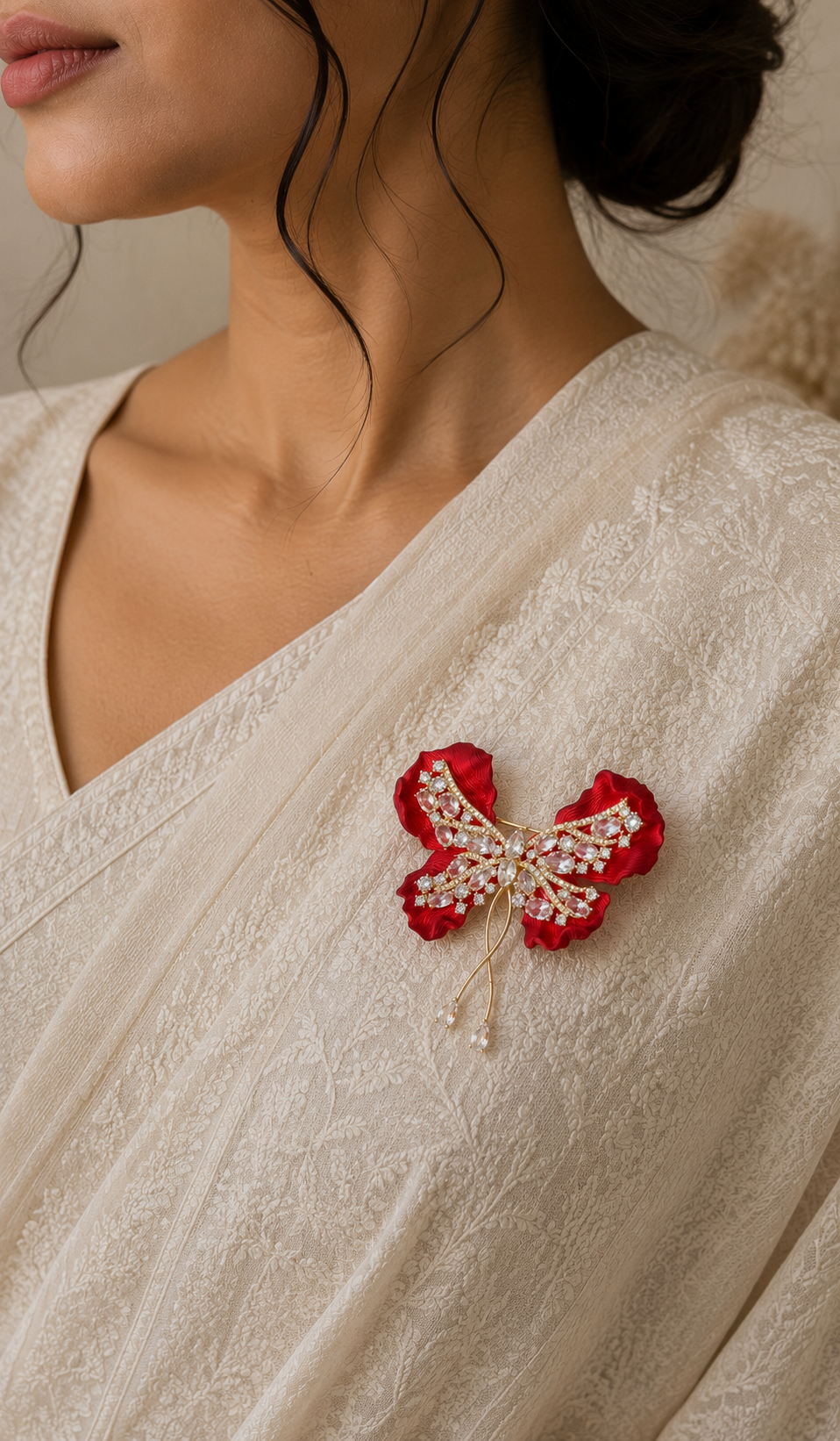 Crimson Bow Butterfly Brooch worn on a white sari
