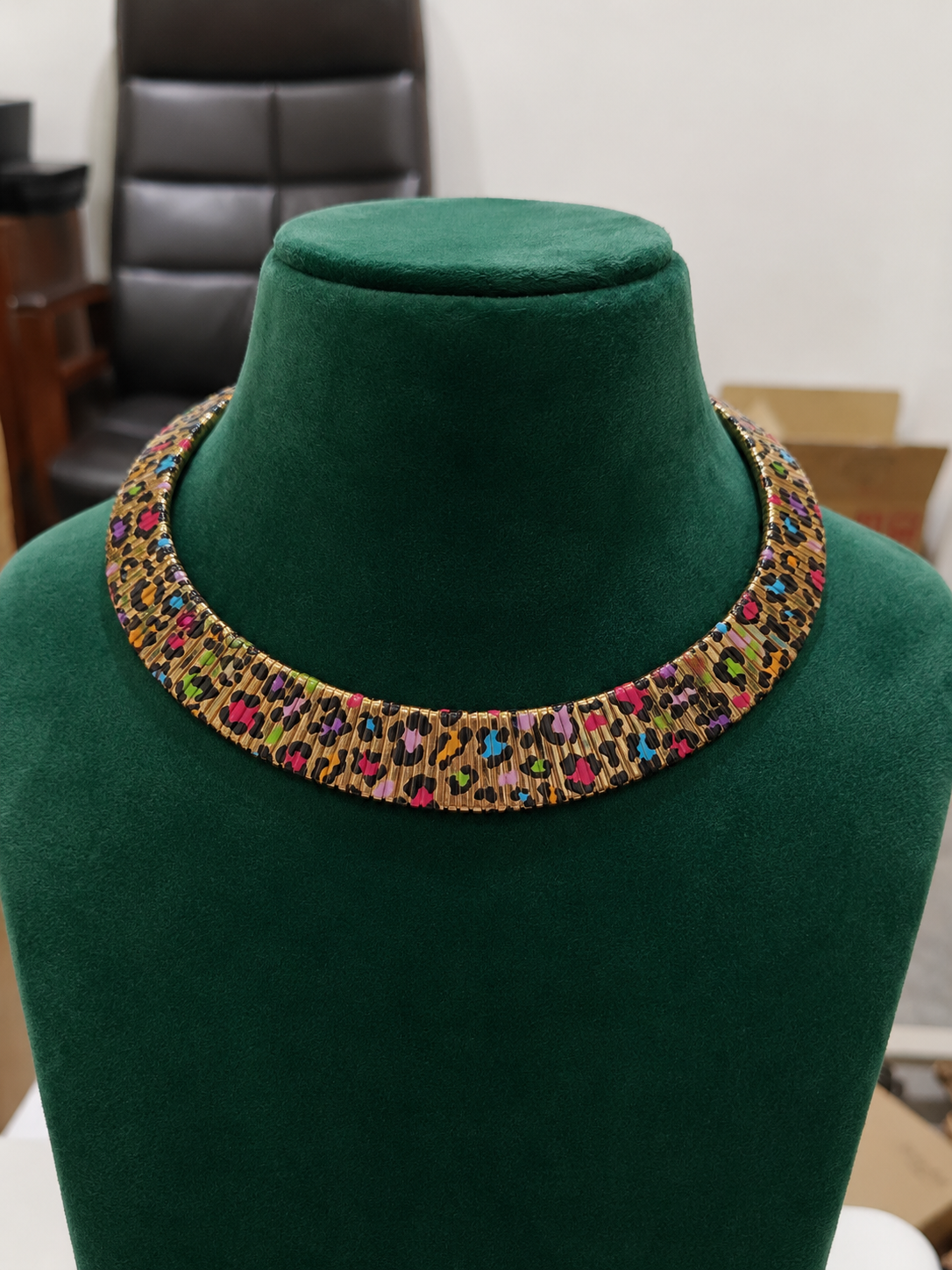 Rainbow Mosaic Enamel Necklace Set displayed on a green jewellery bust