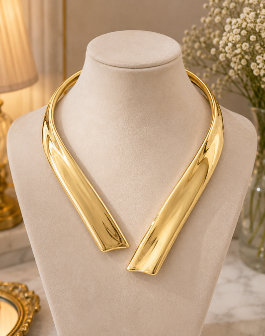 Golden Arc Collar Necklace displayed on a jewellery bust