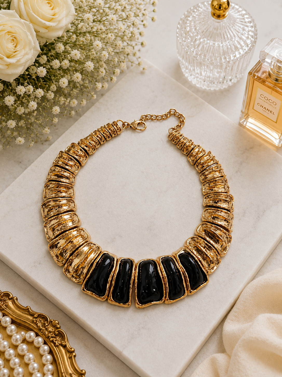 Midnight Ivory Enamel Necklace shown in a styled flat lay