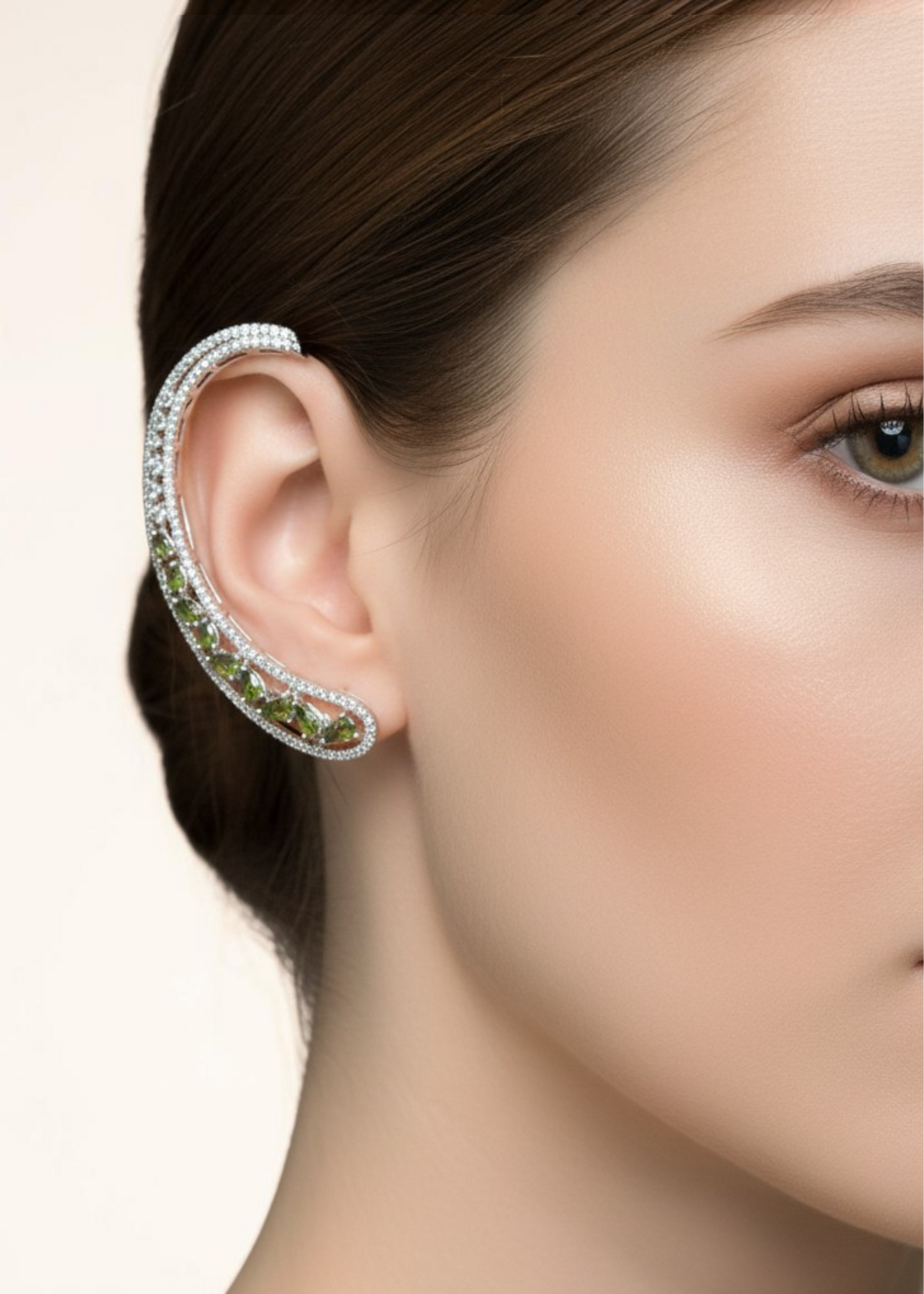 Model wearing Celeste Olive Green Stone Ear Cuff with silver-tone setting and olive green crystal stones