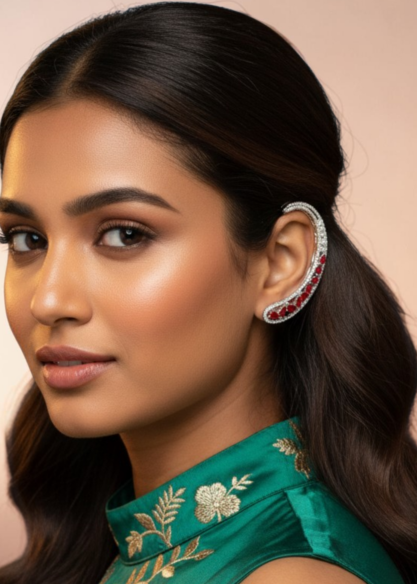 Model wearing Celeste Red Stone Ear Cuff with silver-tone setting and red crystal stones