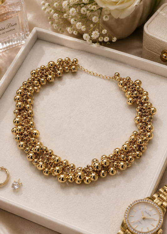 Gold Bead Statement Necklace flat lay showcasing clustered gold-tone bead design and adjustable statement neckpiece