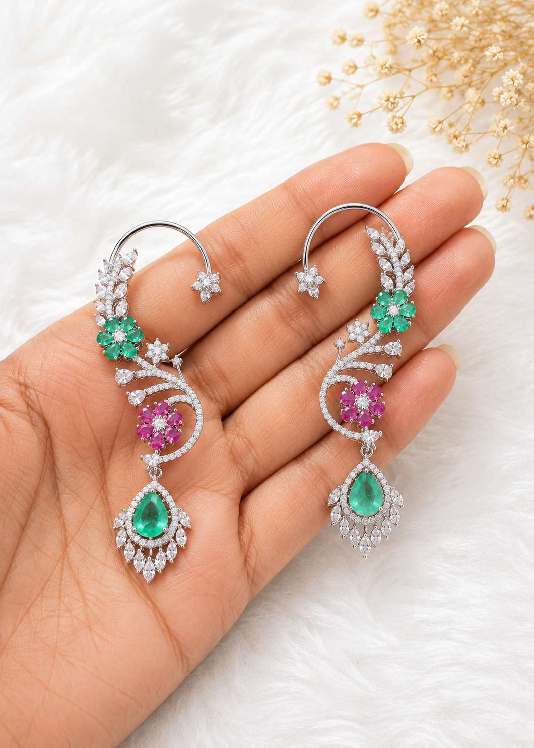 Close-up of Verdelle CZ Floral Ear Cuff Set with emerald green floral stones, pink accents and sparkling cubic zirconia detailing.