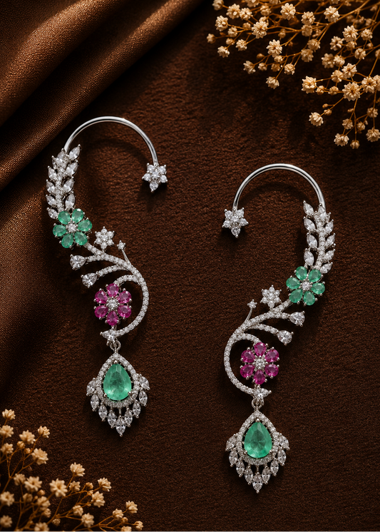 Verdelle CZ Floral Ear Cuff Set featuring emerald green floral stones, pink flower accents, cubic zirconia leaves and teardrop pendant on luxury flat lay background.