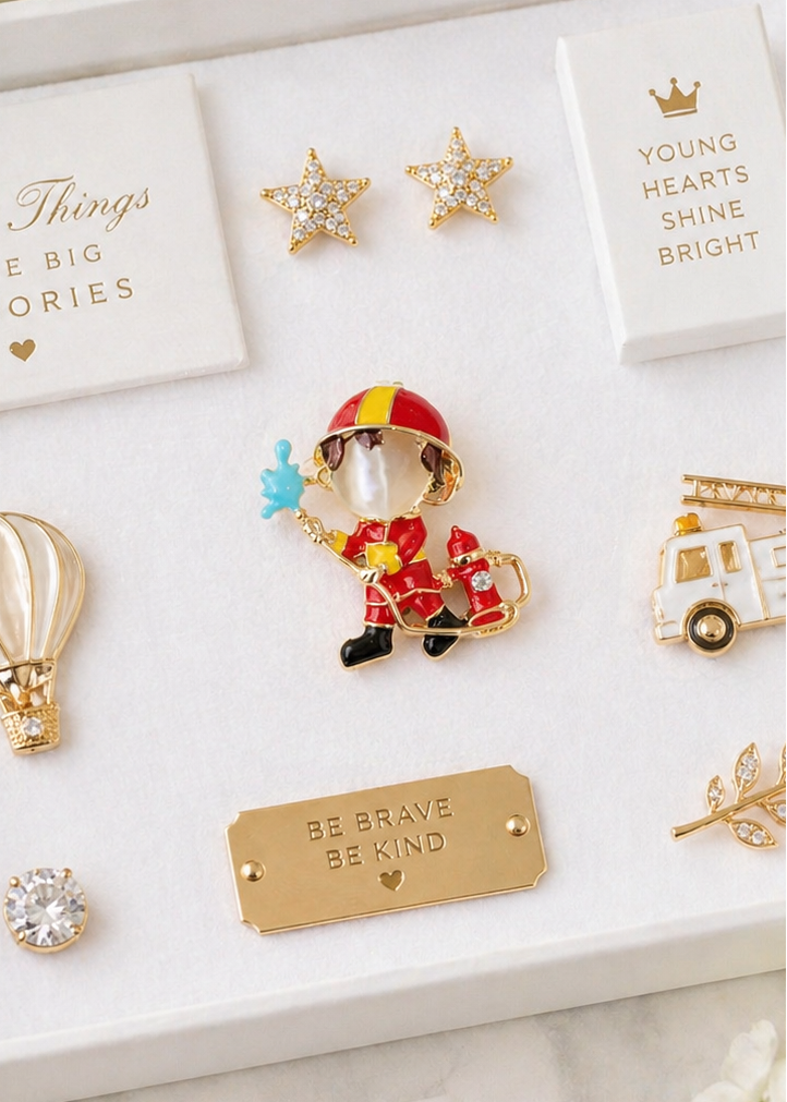 Red fireman brooch