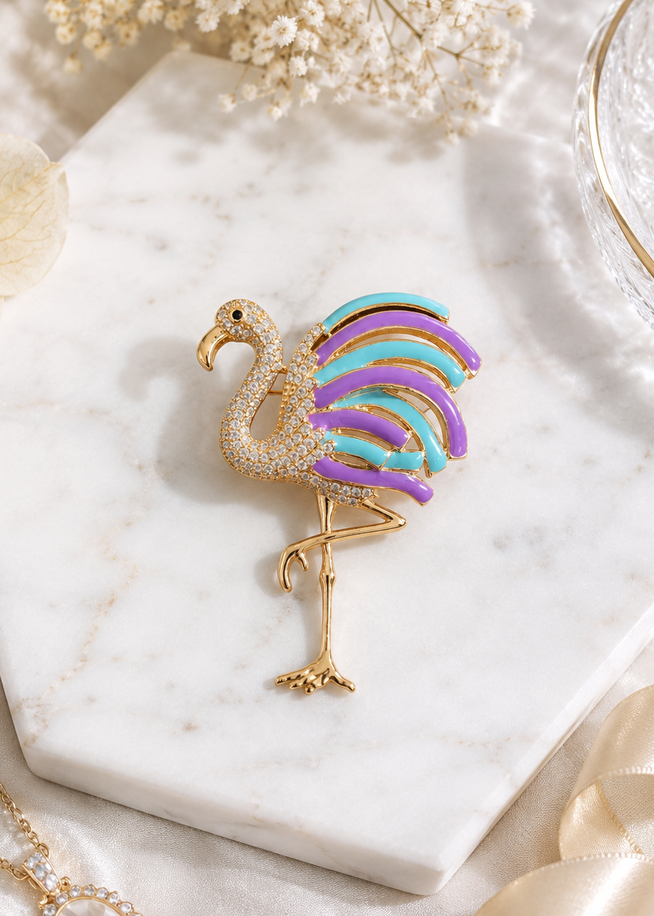 Luna Lavender Crystal Flamingo Brooch featuring sparkling lavender crystals, enamel detailing, and a gold-tone flamingo design