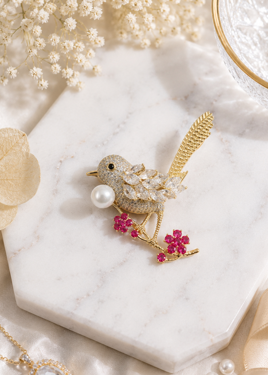 Shop the Golden Sparrow Crystal Bird Brooch by Gems2Gel. Featuring sparkling crystals, delicate floral accents, and an elegant bird-inspired design, perfect for sarees, dresses, blazers, and special occasions.