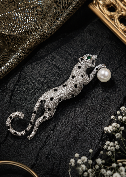 Midnight Pearl Panther Brooch displayed in a dark studio flat lay