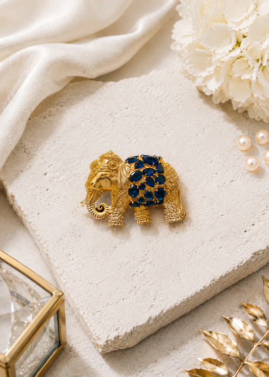 Royal Blue Elephant Brooch displayed in a studio flat lay