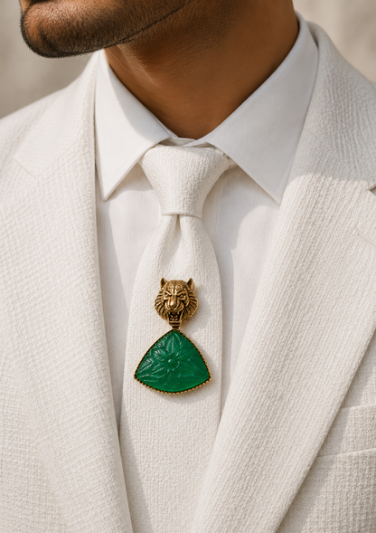 Emerald Tiger Carved-Stone Brooch worn on a white jacket by a man