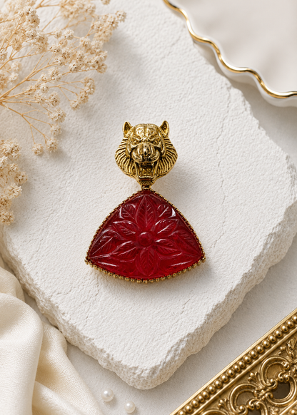 Crimson Tiger Carved-Stone Brooch displayed in a light studio flat lay