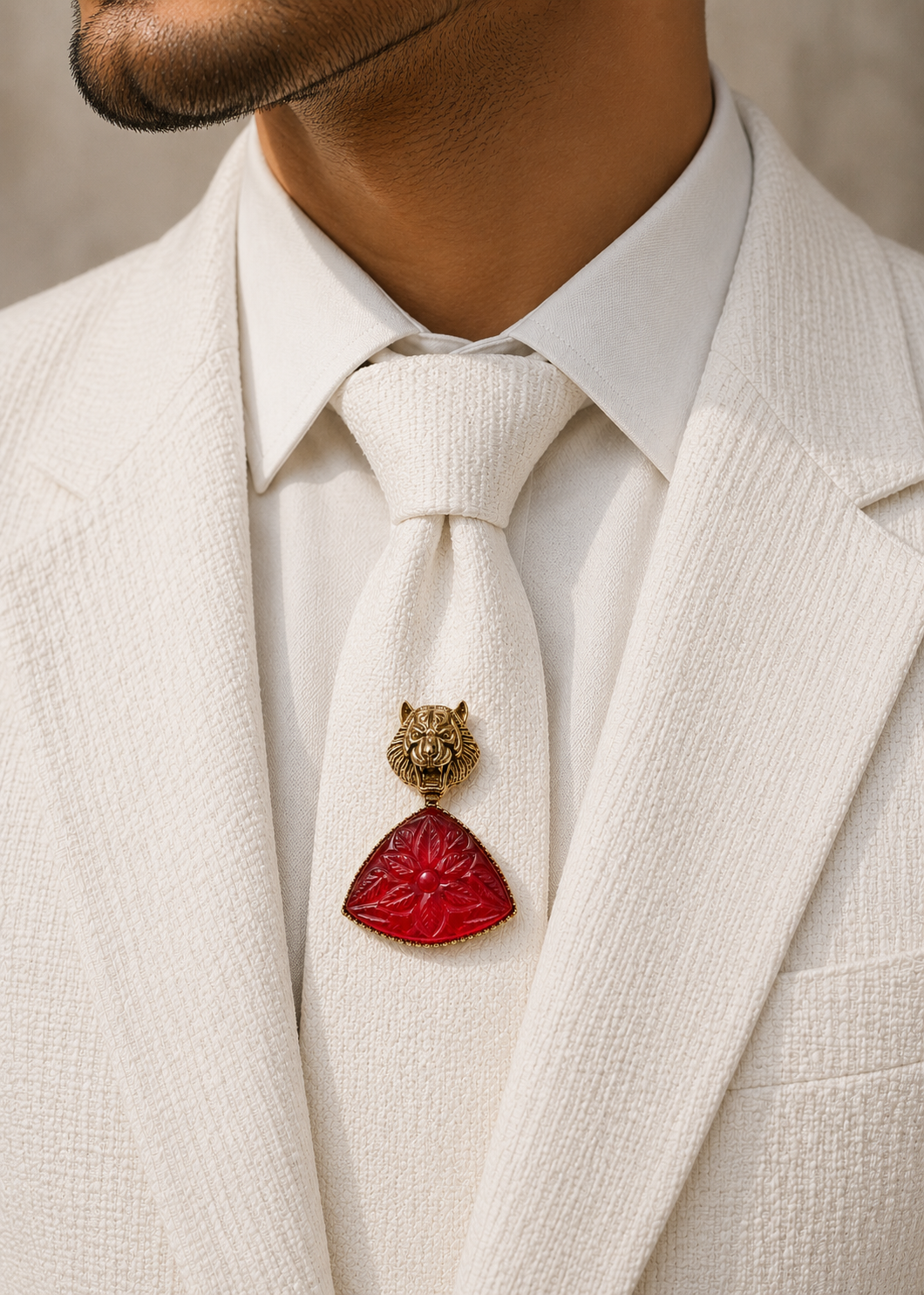 Crimson Tiger Carved-Stone Brooch worn on a white jacket by a man