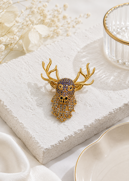 Celestial Stag Crystal Brooch displayed in a light studio flat lay