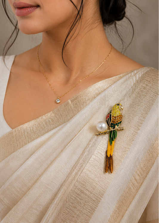 Golden Parrot Pearl Brooch worn on a cream saree