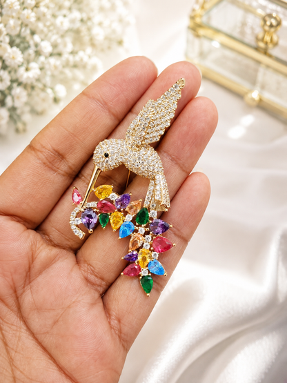 Rainbow Hummingbird Crystal Brooch shown close up in hand