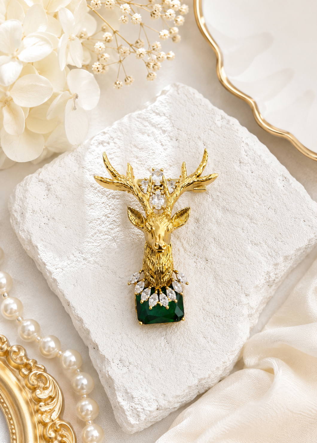 Emerald Crown Stag Crystal Brooch displayed in a light studio flat lay