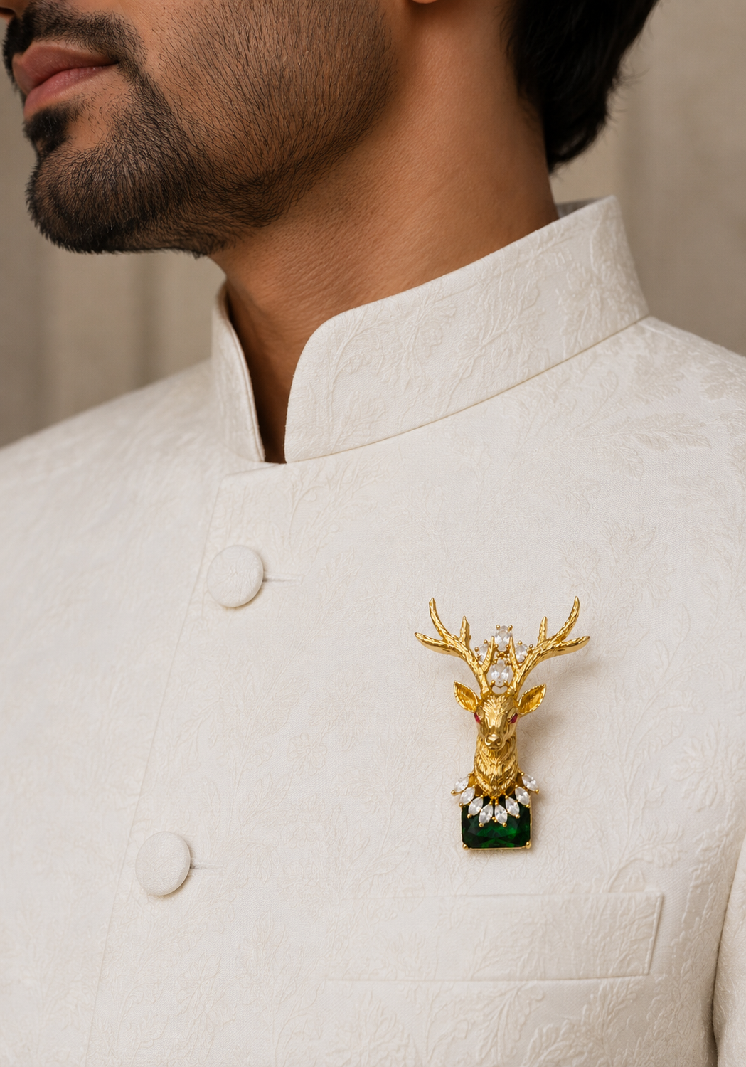 Emerald Crown Stag Crystal Brooch worn on an ivory traditional jacket