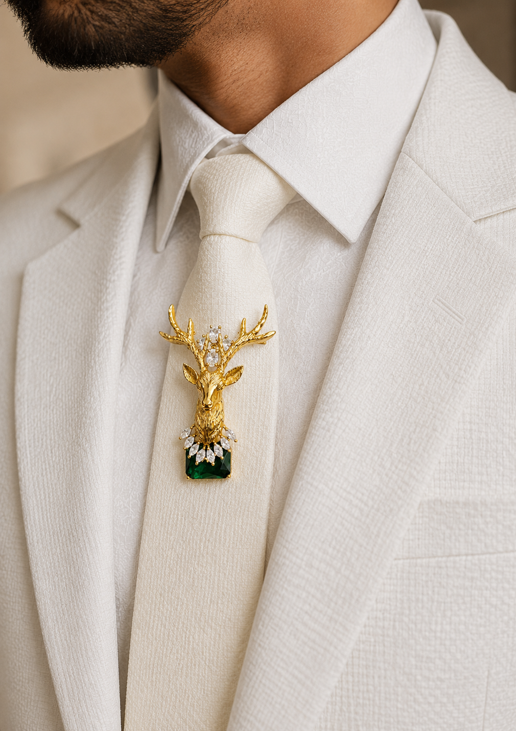 Emerald Crown Stag Crystal Brooch styled on an ivory tie