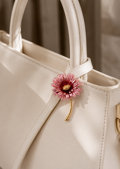 Blush Daisy Stem Brooch styled on a white handbag