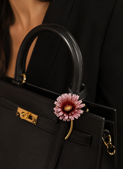 Blush Daisy Stem Brooch styled on a black handbag