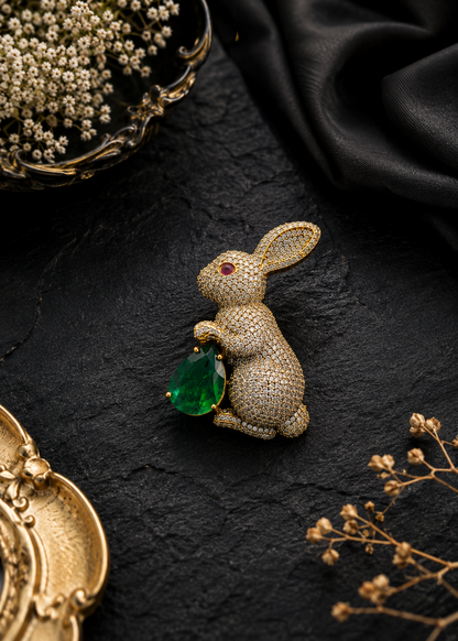 Emerald Bunny Crystal Brooch displayed in a dark studio flat lay