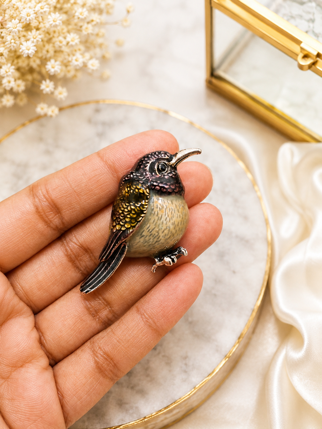 Twilight Hummingbird Crystal Brooch shown close up in hand