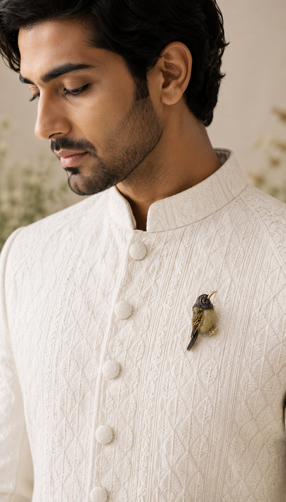 Twilight Hummingbird Crystal Brooch worn on an ivory traditional jacket