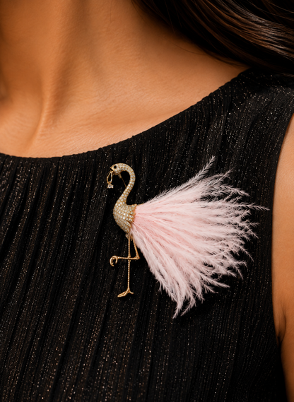 Blush Plume Flamingo Brooch worn on a black dress