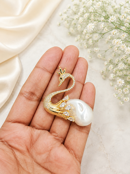 Pearl Swan Crystal Brooch shown close up in hand