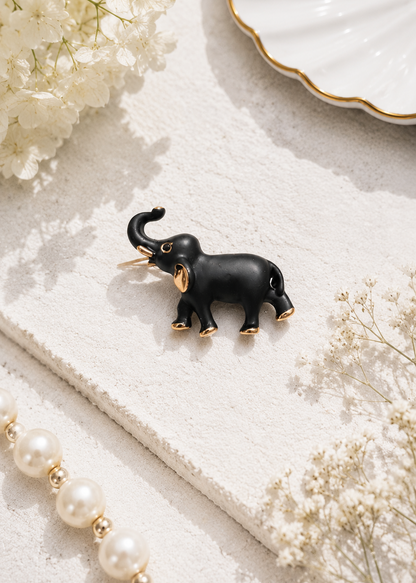 Midnight Charm Elephant Brooch displayed in a light studio flat lay