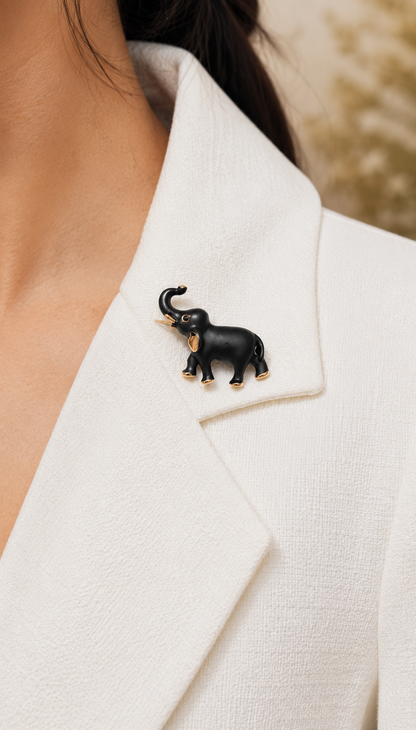 Midnight Charm Elephant Brooch worn on a white blazer close up
