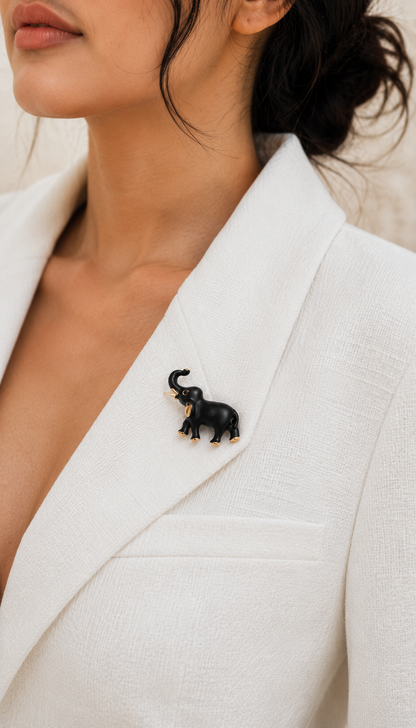 Midnight Charm Elephant Brooch worn on a white blazer