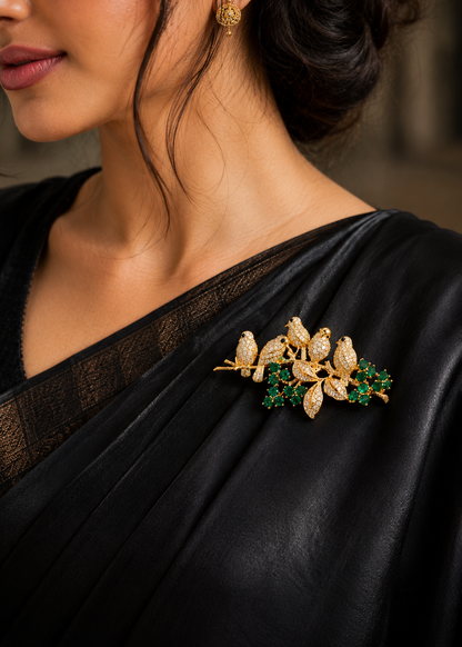 Emerald Songbird Floral Brooch worn on a black sari