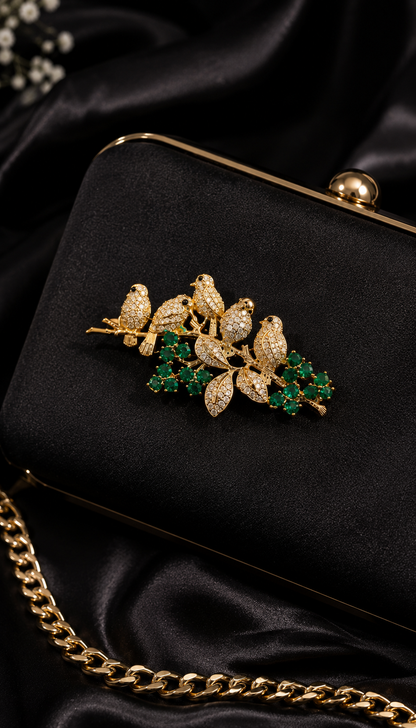 Emerald Songbird Floral Brooch styled on a black evening clutch