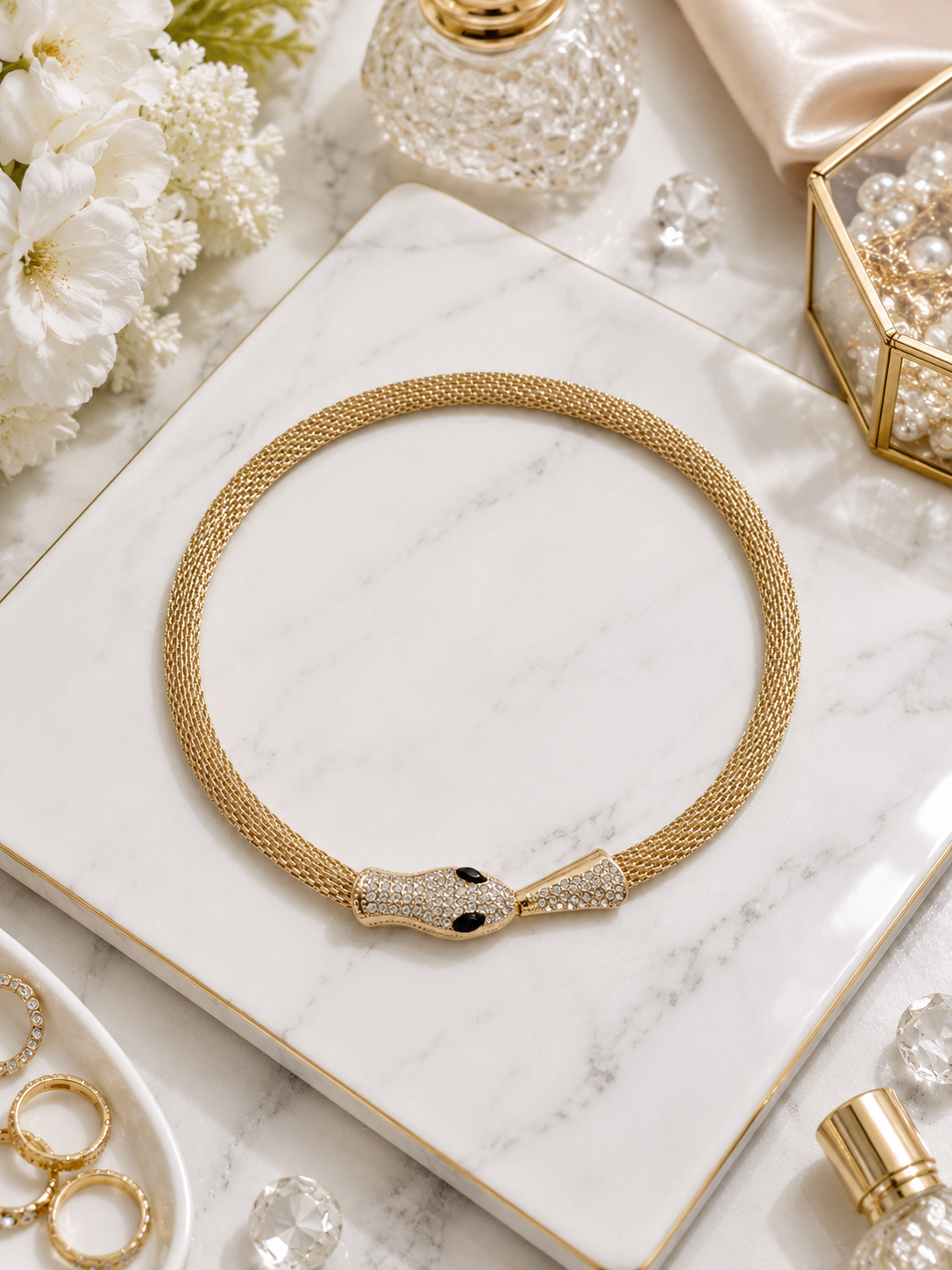 Midnight Serpent Mesh Necklace shown in a styled flat lay