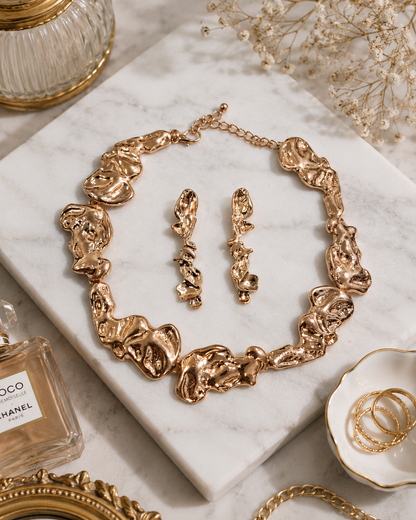 Rose Cascade Floral Necklace Set shown in a flat lay with matching earrings