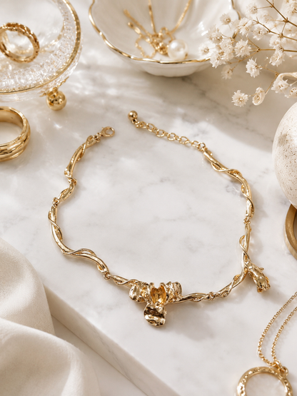 Golden Vine Floral Necklace shown in a styled flat lay