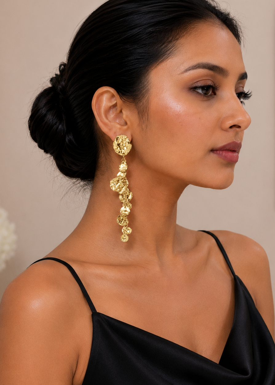 Woman wearing Molten Gold Dangler Statement Earrings