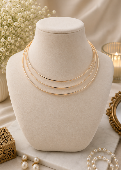 Aurora Gold Layered Hasli with sleek triple-layer polished gold finish displayed on a jewelry bust.