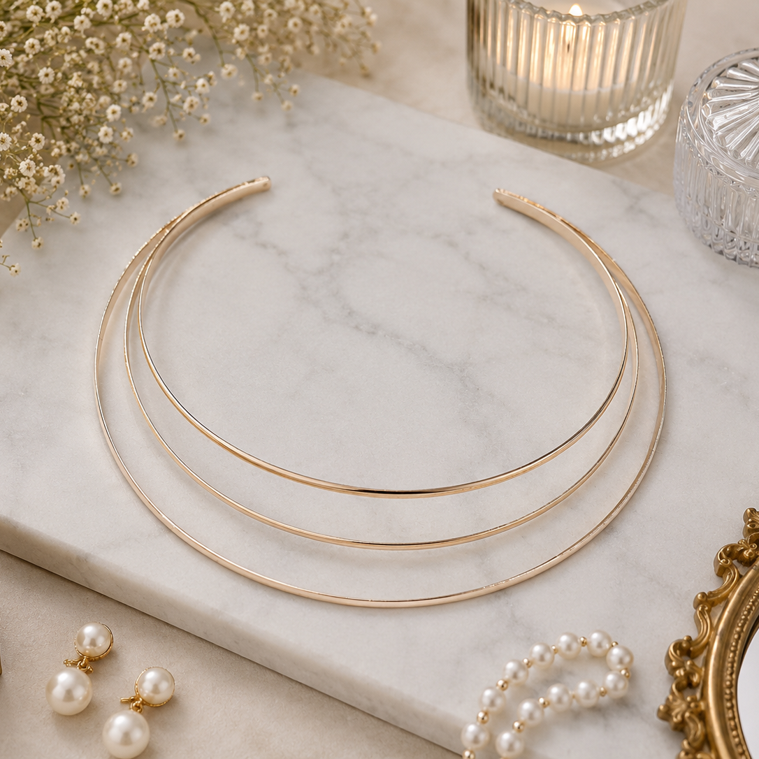 Aurora Gold Layered Hasli featuring a polished triple-layer gold design displayed on a marble surface.