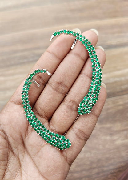 Celeste Green Crystal Ear Cuff with shimmering green crystals and curved silver-tone ear climber design