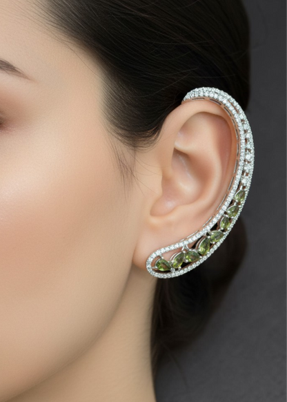 Close-up of Celeste Olive Green Stone Ear Cuff with sparkling olive green stones and silver-tone finish