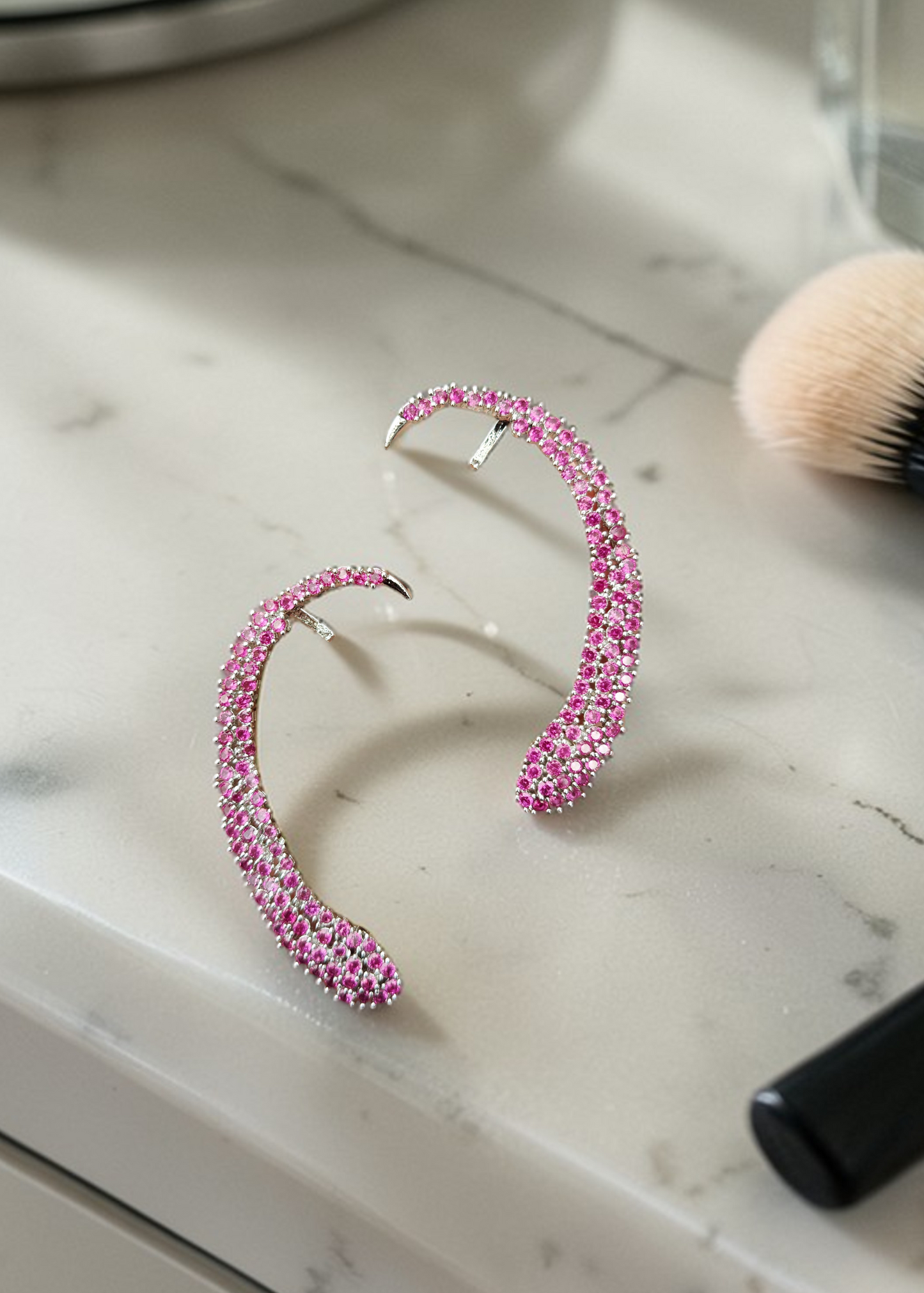 Celeste Pink Crystal Ear Cuff featuring pink crystal stones set in a silver-tone statement ear cuff