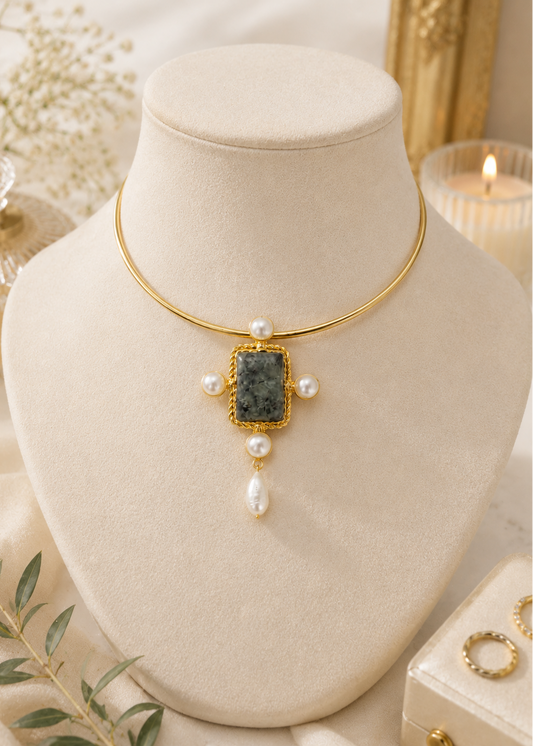 Celeste Stone Hasli featuring a natural semi-precious green stone, pearl accents and gold finish displayed on a jewelry bust.