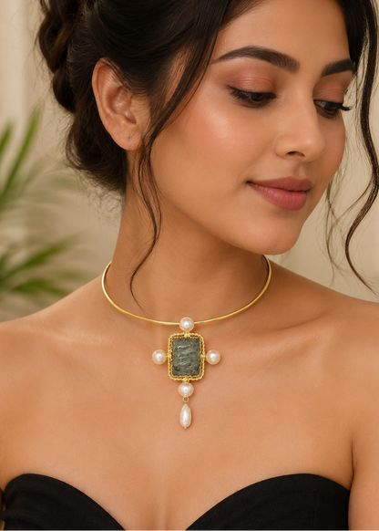 Model wearing Celeste Stone Hasli featuring a natural semi-precious green stone with pearl accents and gold finish.