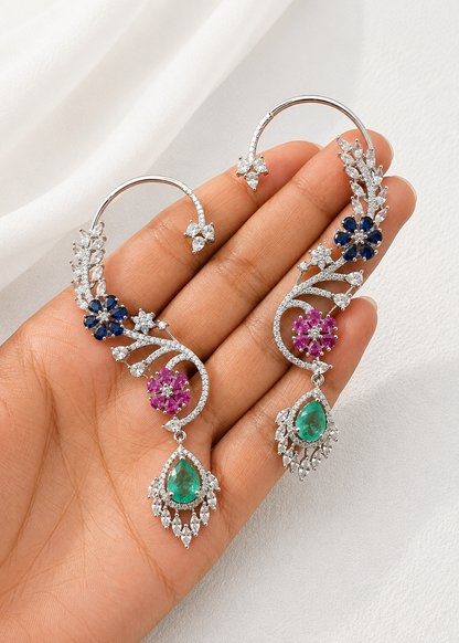 Close-up of Celestia CZ Floral Ear Cuff Set showcasing sapphire blue, emerald green and ruby pink floral stones with cubic zirconia detailing.